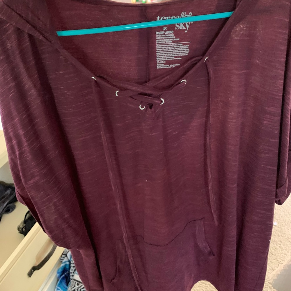 Comfy top with lace up neck./pocket/hood